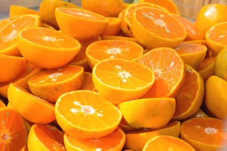 Orange gets cut in half the wait to squeeze out.の写真素材