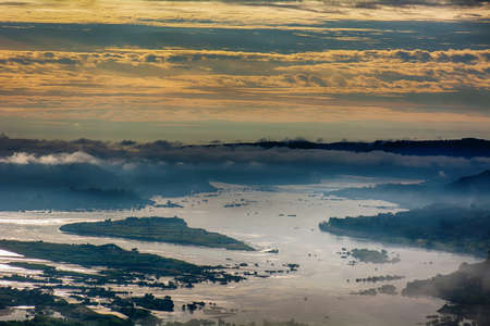 Forests, mountains, fog and golden cloudy sky are landscape in Thailand.の写真素材
