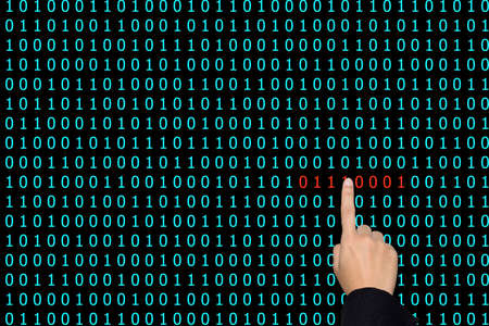 Businesswoman are pointing binary code problems.の写真素材