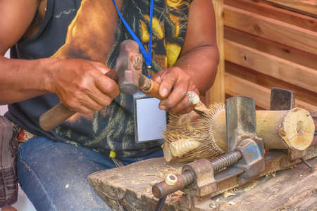 The man is working wood. It is a craft.の写真素材