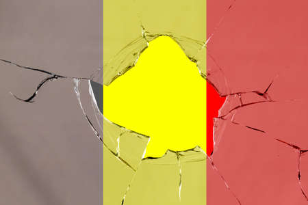 Flag of Belgium on a on glass breakage.の写真素材