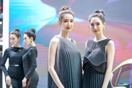 Nonthaburi, Thailand - DEC 3, 2019: Unidentified model poses with a car at The 36th Motor Expo Thailand 2019 at IMPACT Arena, Muang Thong Thani, Nonthaburi, Thailand.のeditorial素材