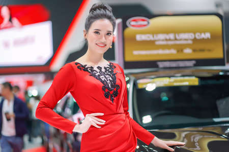 Nonthaburi, Thailand - DEC 3, 2019: Unidentified model poses with a car at The 36th Motor Expo Thailand 2019 at IMPACT Arena, Muang Thong Thani, Nonthaburi, Thailand.のeditorial素材
