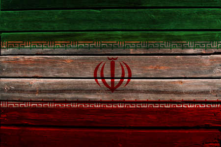 3D Flag of Iran on a wood wall background.の写真素材