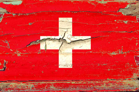 3D Flag of Switzerland on a old wood wall background.の写真素材