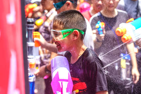 Siam Square, Bangkok, Thailand - APR 13, 2019: short action of people joins celebrations of the Thai New Year or Songkran in Siam Square.のeditorial素材