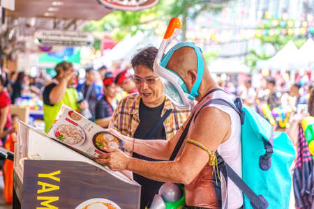 Siam Square, Bangkok, Thailand - APR 13, 2019: short action of people joins celebrations of the Thai...