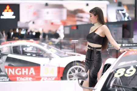 Nonthaburi, Thailand - DEC 3, 2019: Unidentified model poses with a car at The 36th Motor Expo Thailand 2019 at IMPACT Arena, Muang Thong Thani, Nonthaburi, Thailand.のeditorial素材