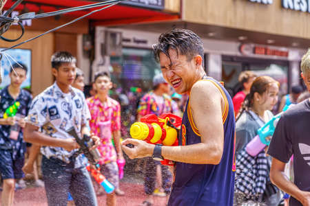 Siam Square, Bangkok, Thailand - APR 13, 2019: short action of people joins celebrations of the Thai New Year or Songkran in Siam Square.のeditorial素材