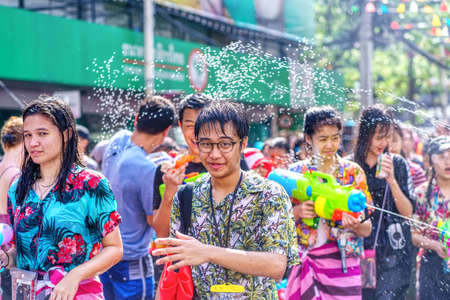 Siam Square, Bangkok, Thailand - APR 13, 2019: short action of people joins celebrations of the Thai New Year or Songkran in Siam Square.のeditorial素材