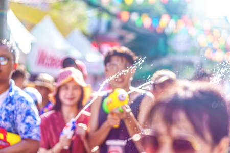 Songkran Festival or Songkran is celebrated in Thailand as the traditional New Year's Day from 13 to 15 April. People getting soaked during Songkran.の写真素材