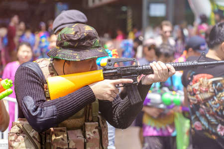 Siam Square, Bangkok, Thailand - APR 13, 2019: short action of people joins celebrations of the Thai New Year or Songkran in Siam Square.のeditorial素材