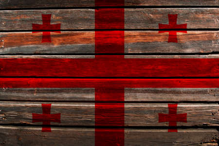 3D Flag of Georgia on a old wood wall background.の写真素材