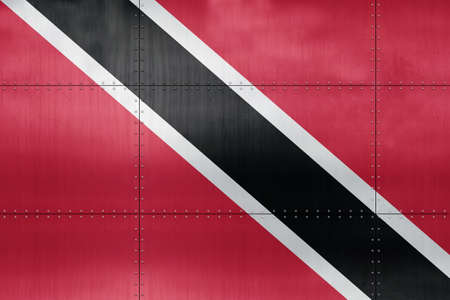 3D Flag of Trinidad and Tobago on a metal wall background.の写真素材
