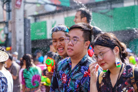 Siam Square, Bangkok, Thailand - APR 13, 2019: short action of people joins celebrations of the Thai New Year or Songkran in Siam Square.のeditorial素材