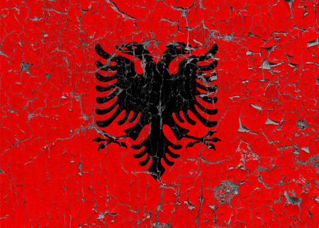 3D Flag of Albania on an old stone wall background.の写真素材