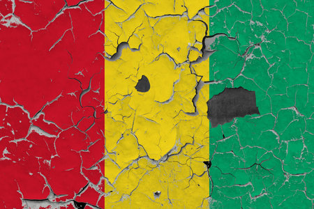 3D Flag of Guinea on an old stone wall background.の写真素材