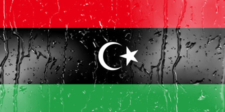 3D Flag of Libya on a glass with water drop background.の写真素材