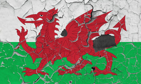 3D Flag of Wales on an old stone wall background.の写真素材