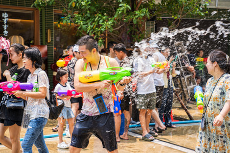 Siam Square, Bangkok, Thailand - APR 13, 2023 Songkran Festival, The short action of people joins celebrations of the Thai New Year or Songkran in Siam Square Bangkok, Thailand.のeditorial素材