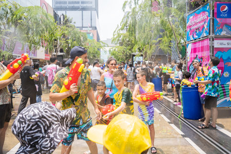 Siam Square, Bangkok, Thailand - APR 13, 2023 Songkran Festival, The short action of people joins celebrations of the Thai New Year or Songkran in Siam Square Bangkok, Thailand.のeditorial素材
