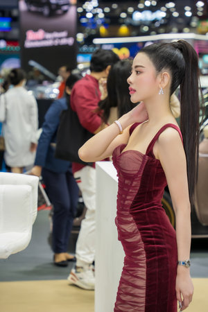 Nonthaburi, Thailand - APR 2, 2023 Unidentified model poses with a car at The 44th Bangkok international motor show 2023 at IMPACT Arena, Muang Thong Thani, Nonthaburi, Thailand.のeditorial素材
