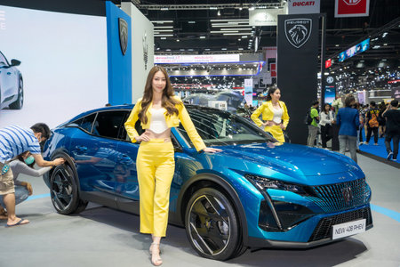 Nonthaburi, Thailand - APR 2, 2023 Unidentified model poses with a car at The 44th Bangkok international motor show 2023 at IMPACT Arena, Muang Thong Thani, Nonthaburi, Thailand.のeditorial素材