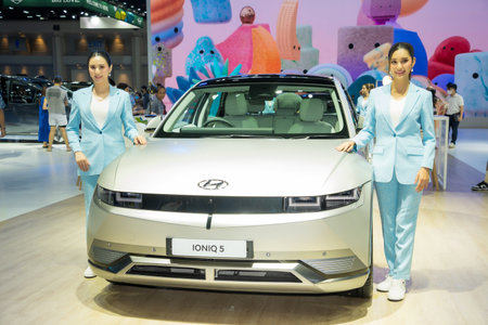 Nonthaburi, Thailand - APR 2, 2023 Unidentified model poses with a car at The 44th Bangkok international motor show 2023 at IMPACT Arena, Muang Thong Thani, Nonthaburi, Thailand.のeditorial素材