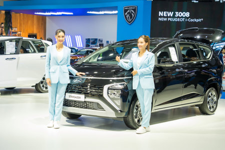 Nonthaburi, Thailand - APR 2, 2023 Unidentified model poses with a car at The 44th Bangkok international motor show 2023 at IMPACT Arena, Muang Thong Thani, Nonthaburi, Thailand.のeditorial素材