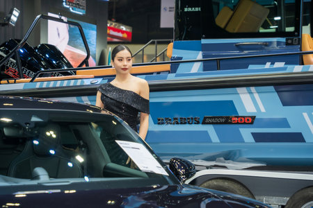 Nonthaburi, Thailand - APR 2, 2023 Unidentified model poses with a car at The 44th Bangkok international motor show 2023 at IMPACT Arena, Muang Thong Thani, Nonthaburi, Thailand.のeditorial素材
