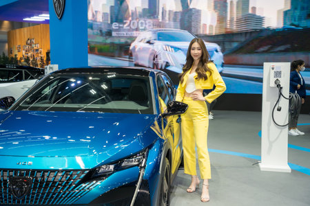 Nonthaburi, Thailand - APR 2, 2023 Unidentified model poses with a car at The 44th Bangkok international motor show 2023 at IMPACT Arena, Muang Thong Thani, Nonthaburi, Thailand.のeditorial素材