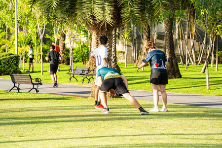 People warming up before running in the park.の写真素材
