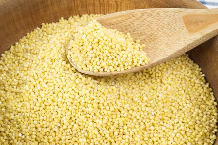millet in a wooden bowl