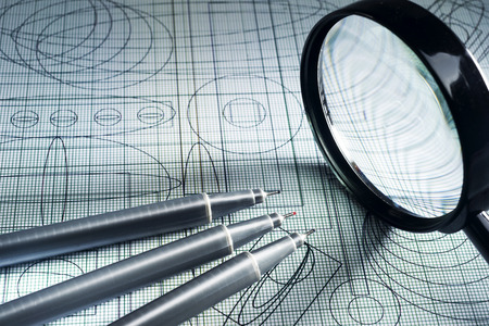 drawing,  magnifying glass and technical pen, selective focusの写真素材