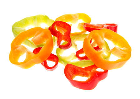 Sliced peppers isolated on whiteの写真素材