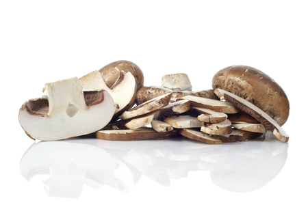 fresh mushroom champignon isolated on white backgroundの写真素材