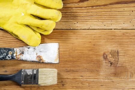gloves, pallet and brush on wooden backgroundの写真素材