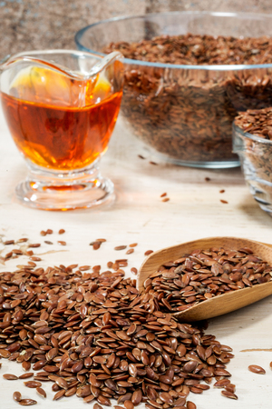 brown flax seed and linseed oil, selective focusの写真素材