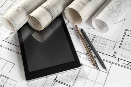 Architectural project, tablet, pen and compassesの写真素材