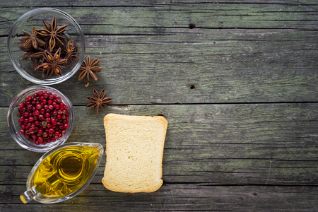 spices and rusks on wooden table の写真素材