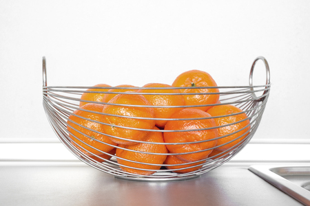 Fresh tangerines on kitchen barの写真素材