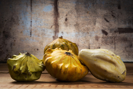 Decorative pumpkins on wooden tableの写真素材