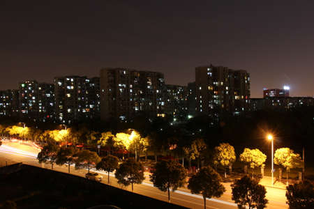 Landscape view of a row of building at nightの写真素材