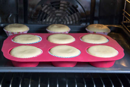 muffins in ovenの写真素材