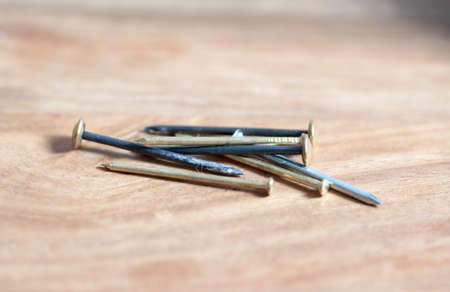 nails on wooden backgroundの写真素材