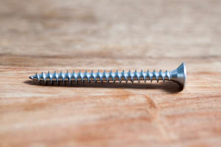 Screws on wooden backgroundの写真素材