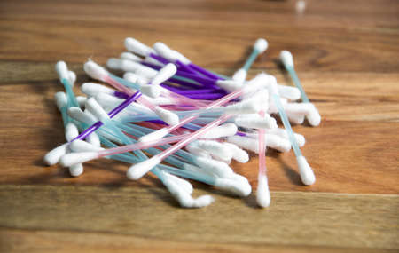 cotton swabs on wooden background