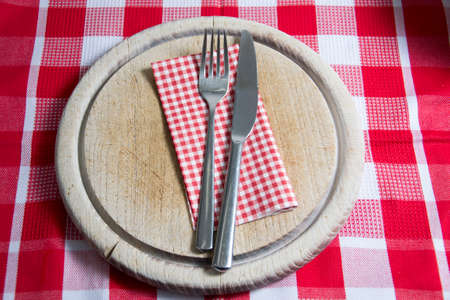 wooden plate with cutleryの写真素材