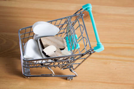 wooden hearts  in a shopping cartの写真素材