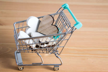 wooden hearts  in a shopping cartの写真素材